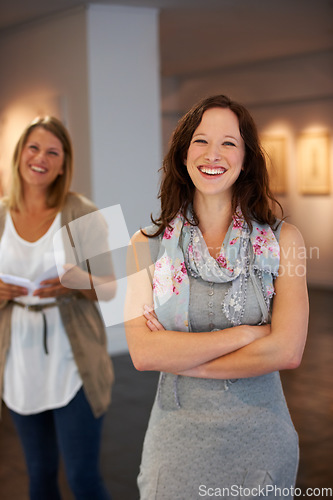 Image of Smile, arms crossed and portrait of a woman with pride in art, exhibition and work at a gallery. Happy, learning and a museum manager or employee at a job for creativity, teaching and culture