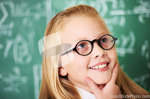 Image of Thinking, idea and child student with glasses by board for planning, decision or brainstorming in classroom. Education, learning and girl kid with choice, vision or solution face expression in school