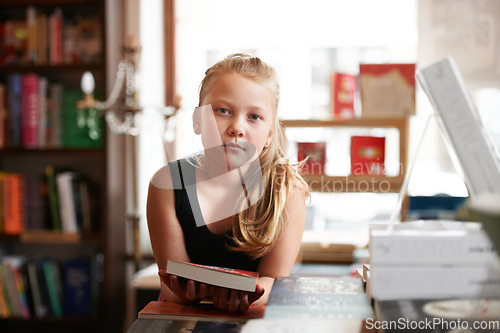 Image of Girl kid in portrait, book and education, story for knowledge or entertainment with customer in bookshop. Library, store and learn for development and growth, fiction or literature with young child