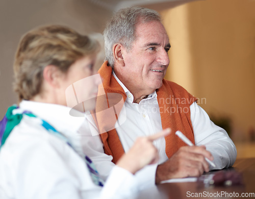 Image of Hotel, reception and senior couple sign by check in desk for love, anniversary and relax. Retirement, hospitality resort and elderly man and woman with concierge for travel, holiday and vacation