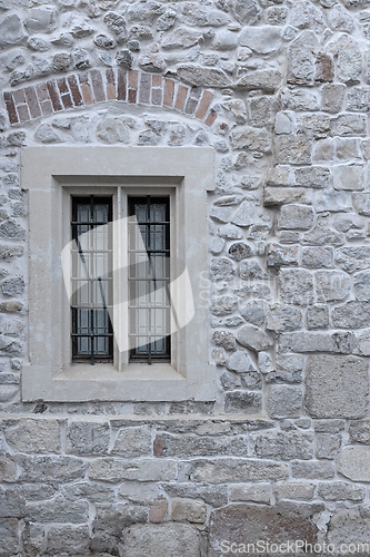 Image of window on old church wall