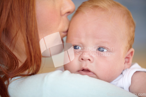 Image of Kiss, baby and portrait of newborn with mother in home bonding together with affection. Calm, face and mom carrying infant child in arms to relax in house with love, care and support with mommy