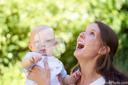 Image of Woman, baby and smile outdoor in garden for care, love or bonding on holiday, summer sunshine or thinking. Happy mother, infant child and comic laugh in backyard, park or woods with family in spring