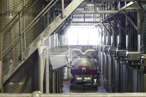 Image of Background, wine factory and tank equipment for alcohol, whiskey and beer production, manufacturing and industry. Warehouse, steel container and industrial machine in winery, distillery and brewery