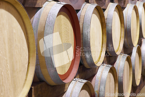 Image of Background, wine production and oak barrel in brewery for beer, alcohol manufacturing and whiskey fermentation. Closeup, wood cask and liquor storage container in winery, factory and distillery vault