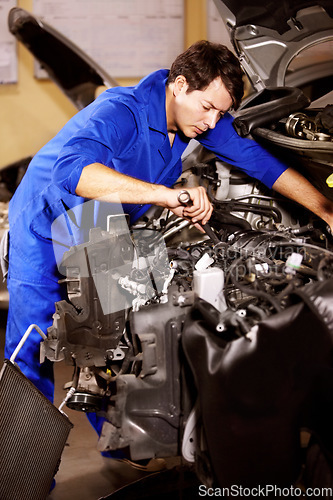 Image of Spanner, man and mechanic check engine of car, repair or maintenance. Wrench tools, technician and serious person on motor vehicle, fix transportation or inspection at auto service workshop or garage