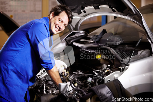 Image of Portrait, happy man and mechanic check oil on engine of car, repair and maintenance. Face, smile and technician on motor vehicle, fixing transport or inspection at auto service workshop or business