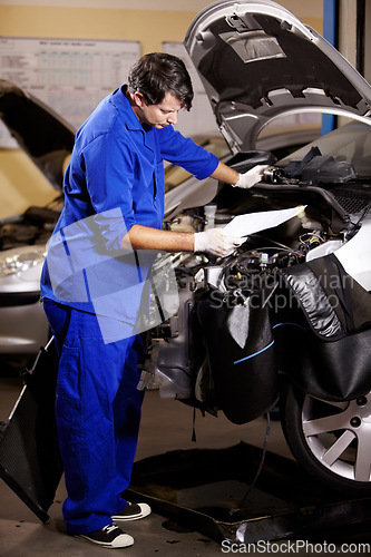 Image of Document, man and mechanic check engine of car, repair and maintenance. Checklist, technician and serious person on motor vehicle hood, reading inspection list or fix transport at auto service garage