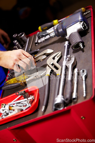 Image of Hands, mechanic and toolbox for auto service at workshop, small business or garage. Closeup, man and equipment, toolkit or metal tools of technician, engineer or expert for repair, maintenance or fix