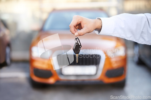 Image of Car, outdoor and businessman with key in hand for sale of auto, transportation and investment. Vehicle, dealership or man with keys in parking lot from salesman for test drive, opportunity or driving