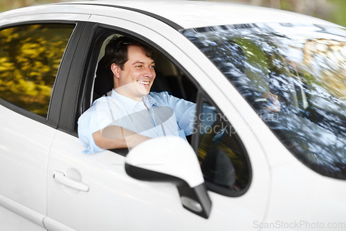 Image of Smile, road trip and a man driving a car outdoor for travel, freedom or adventure in an autumn forest. Journey, ride or commute with a happy young person in a vehicle form transport as a driver