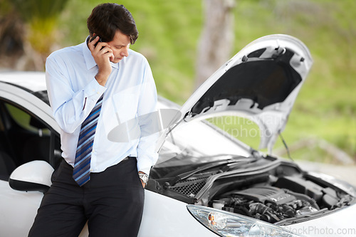 Image of Roadside assistance, phone call and business man by car in conversation, travel or journey. Smartphone, help and serious person with engine breakdown, transportation insurance and emergency support