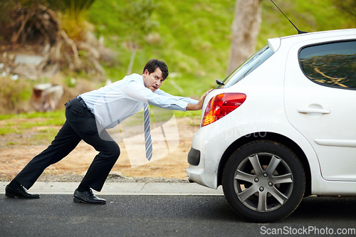 Image of Businessman, push car or breakdown on road engine fail, emergency tyre or auto service. Male person, work transport and face or stress for petrol crisis travel risk, strength or oil accident repair