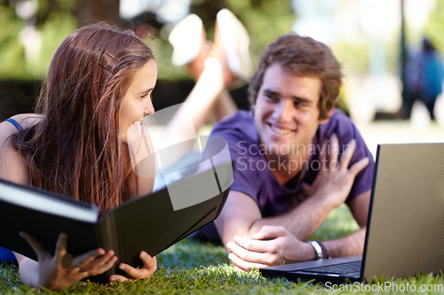 Image of Students, outdoor and laptop on grass, university and smile for workbook, learning and technology. College, notebook and teenager for education, career or studying together for exam, man and woman