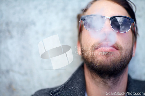 Image of Face, man and smoking outdoor with sunglasses for addiction, experience and enjoyment on mock up space. Person, hipster and smoke on mockup for lifestyle, luxury and exhale or tobacco satisfaction