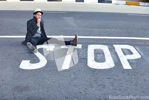 Image of Man, asphalt and stop or sign on road, danger and sitting by symbol, bad habits and addiction to drugs. Male person, nicotine and danger or risk, street and warning of cigarette, awareness and quit