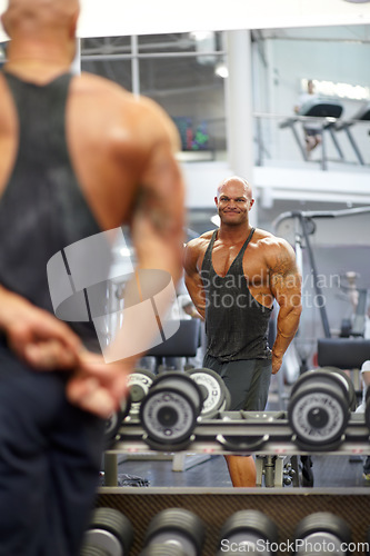 Image of Man, arm flexing and mirror at gym with fitness, workout and exercise of bodybuilder with reflection. Muscle, male person and athlete with sport training, wellness and body builder at a health club