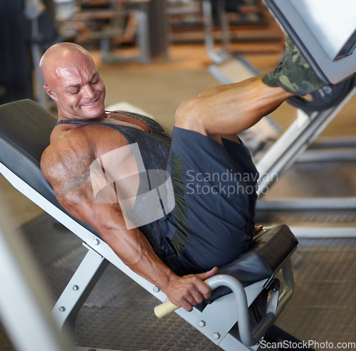 Image of Leg press, man and fitness at gym with bodybuilder, cardio and muscle power at health club. Wellness, athlete and exercise machine with heavy weight and strain from bodybuilding, sport and workout