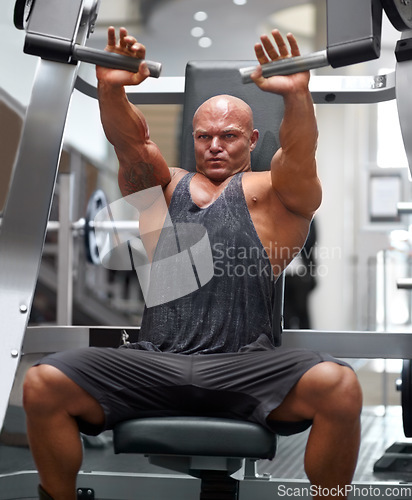 Image of Man in gym, bodybuilder and muscle with fitness, equipment or gear for muscle training, exercise and strong body. Workout, health and bodybuilding, machine for weights and challenge with power