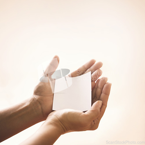 Image of Hands with blank paper, studio mockup and kindness on notification for support, trust and advice. Care, empathy and help on note with empty space for offer, promo or news on white background.