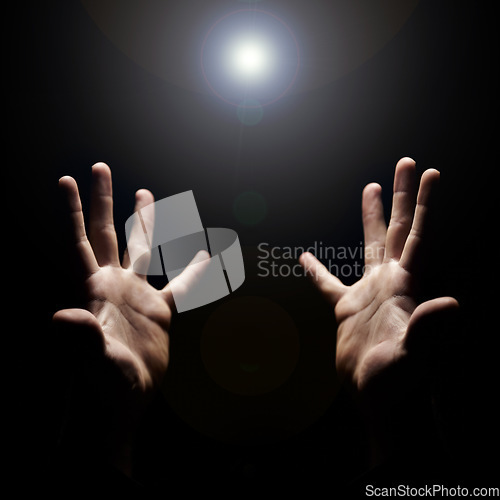 Image of Hands, pray and help from God with praise, closeup of holy person with gratitude and respect for religion. Guide, wellness and lens flare, worship and faith with hope and trust on dark background