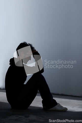 Image of Man, sad or depression with mental health and silhouette, stress or burnout with financial or life crisis. Emotional, thinking about pain and trauma, bankruptcy or debt with anxiety and psychology