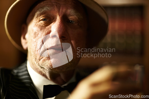 Image of Senior, man and drink of whiskey in office with crime boss thinking of mob or decision. Old, face and experienced gangster with alcohol in mafia or country club with reputation of power or danger