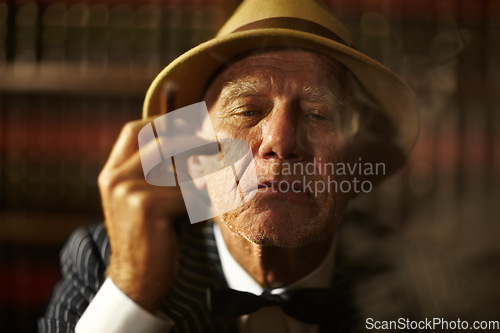 Image of Old man, smoking and portrait in office with cigar, smoke and crime boss of mob with a decision. Thinking, face and senior gangster with cigarette in mafia or club with reputation of power as leader
