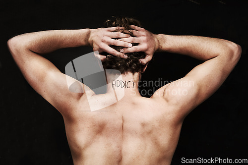 Image of Back, drug addict and body of man in studio isolated on black background. Rear view, addiction and naked person with depression, anxiety and mental health crisis, challenge and substance abuse tattoo