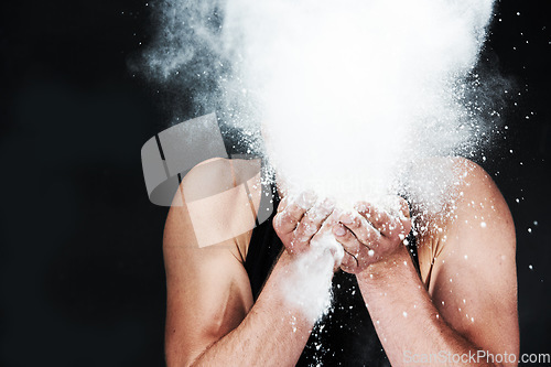 Image of Man, throw and powder in face in studio on black background for mock up in fitness for gymnastics. Male athlete, chalk or dust for grip, hands and sports competition for strength, power or dedication