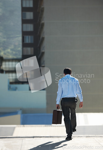 Image of Businessman, suicide and edge with stress, depression or problem on rooftop of building with suitcase for risk. Professional, person or employee with briefcase, mental health and anxiety in city