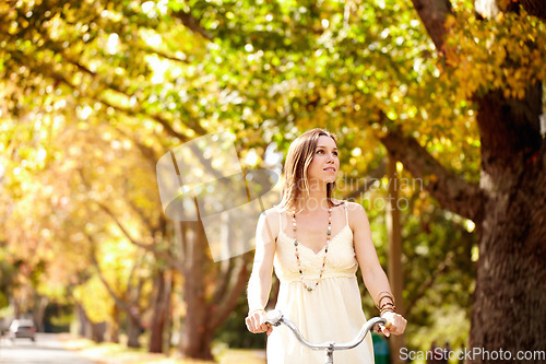 Image of Woman, thinking and cycling for fitness in nature, vacation exercise and eco friendly central park for wellness. New york city, person or trendy fashion with bicycle, sustainability and urban travel