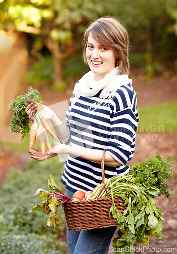 Image of Portrait, woman and vegetable for harvest with basket for fresh, natural or organic produce for vegan diet. Worker, farmer and smile for carrot, tomato or garden for growth in sustainable development