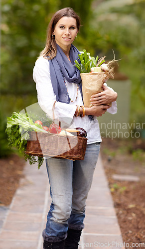 Image of Woman, portrait and vegetables with bag, outdoor and smile with organic product, food and deal in park. Vegan lady, basket or container for shopping, discount or sale with deal, nutrition and diet