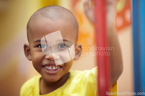 Image of African boy, portrait and smile in classroom at kindergarten with pride for development, scholarship or learning. Child, student and face at school, happy and education for future, growth or academy