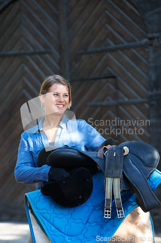 Image of Saddle, ready or happy woman in countryside outdoor with rider or jockey for recreation or wellness. Sports, horse riding tools or equestrian with gear to start training, exercise or workout in ranch