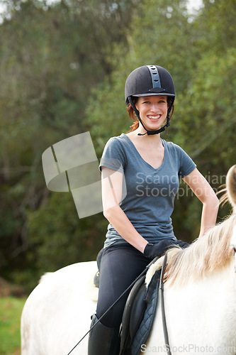 Image of Horse riding, nature or portrait of happy woman in countryside outdoor with jockey for recreation. Sports, smile or female equestrian on an animal to start training, exercise or workout on a farm