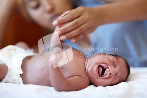 Image of Newborn, crying and cleft palate with mom, bed and hand holding with parent, sick and family home. Medical issue, syndrome and bedroom for healthcare, childcare and mouth for baby, pain and tired