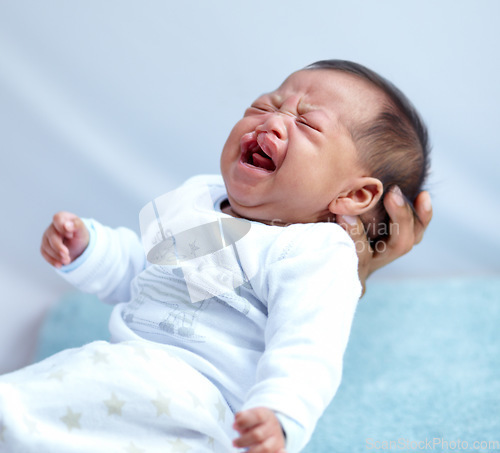 Image of Newborn, crying and cleft palate with parent, mom and home with tears, sick and frustrated. Medical child, syndrome and house bedroom for healthcare, childcare and mouth for baby, pain and sadness