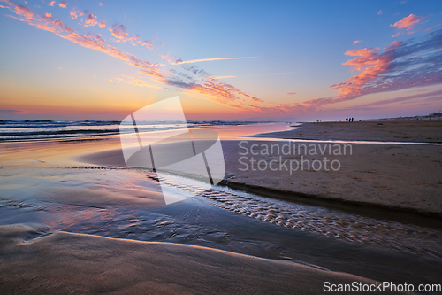 Image of Atlantic ocean sunset with surging waves at Fonte da Telha beach, Portugal