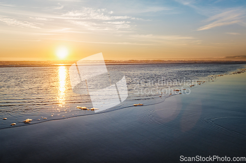 Image of Atlantic ocean sunset with surging waves at Fonte da Telha beach, Portugal