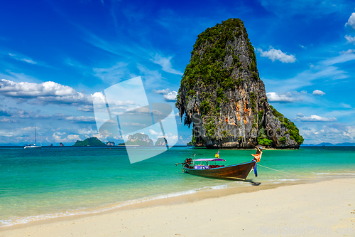 Image of Long tail boat on beach, Thailand