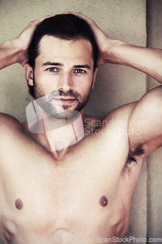 Image of Chest, portrait and man in a bathroom for beauty, wellness or cosmetic treatment on wall background. Face, confident and guy model with dermatology, body care or shower routine results satisfaction