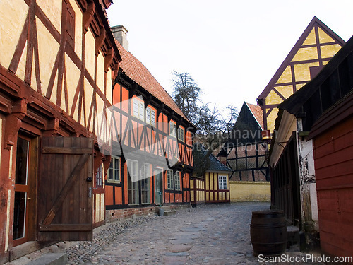 Image of Vintage, countryside and a village with homes for travel, tourism or sightseeing. City, landscape and a road, alley or street with houses for retro or medieval culture or architecture in Europe