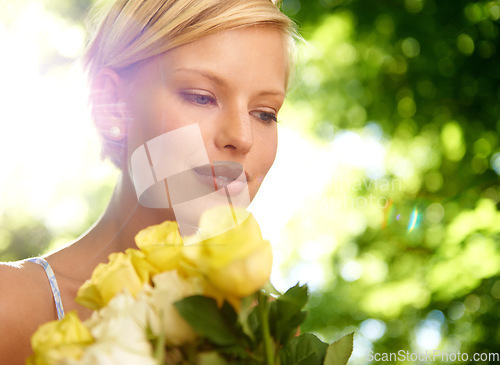 Image of Sunshine, thinking and woman in garden with flowers for holiday in spring on outdoor picnic. Smile, freedom and face of girl in park with happiness, rose bouquet and vacation in countryside to relax.