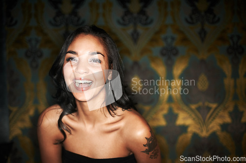 Image of Woman, happy and laugh at nightclub in portrait, laughing and funny or enjoy at event, fun and relax. Mexican female person, smile and positive at party, energy and excited on face, comedy and club