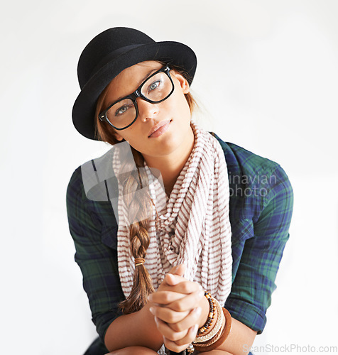 Image of Portrait, hat and woman in glasses for fashion in studio isolated on white background. Face, eyewear and confident girl, serious model and young person in style, cool clothes and scarf in Switzerland