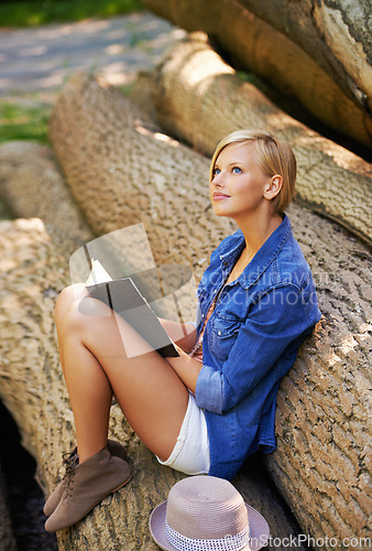 Image of Nature woman, park and thinking about book on natural wellness, stress relief or deforestation. Schedule notebook, tree log or girl inspiration for creative spring story, notes or journal information