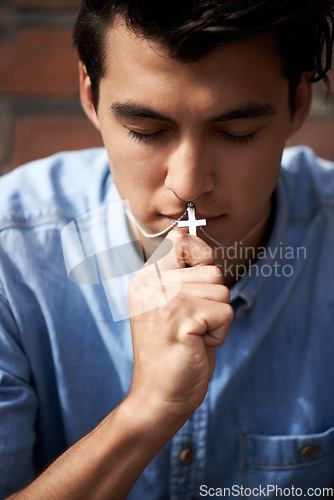 Image of Man, mouth and praying with crucifix for faith, worship and spirituality for soul, support and belief. Male person, confession and hope for forgiveness from god, gratitude and trust in religion
