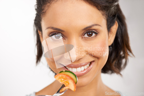 Image of Happy woman, portrait and vegetable salad for diet, snack or natural nutrition against a studio background. Closeup of female person smile and eating organic food for fiber, vitamins or healthy meal